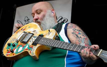 Bowling for Soup guitarist Chris Burney kisses his guitar as the band performs as part of...