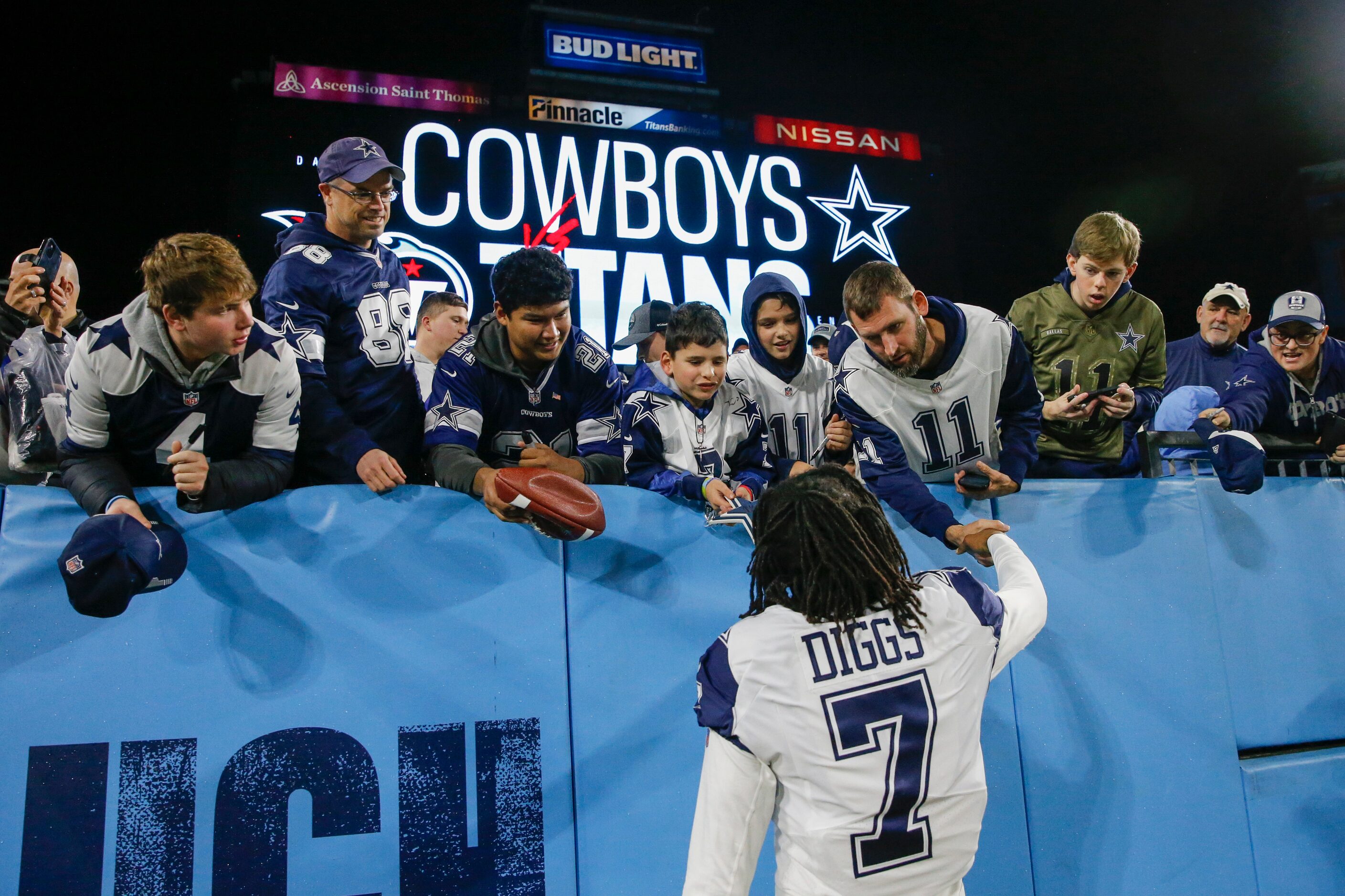 Dallas Cowboys cornerback Trevon Diggs (7) signs autographs for fans before an NFL game at...