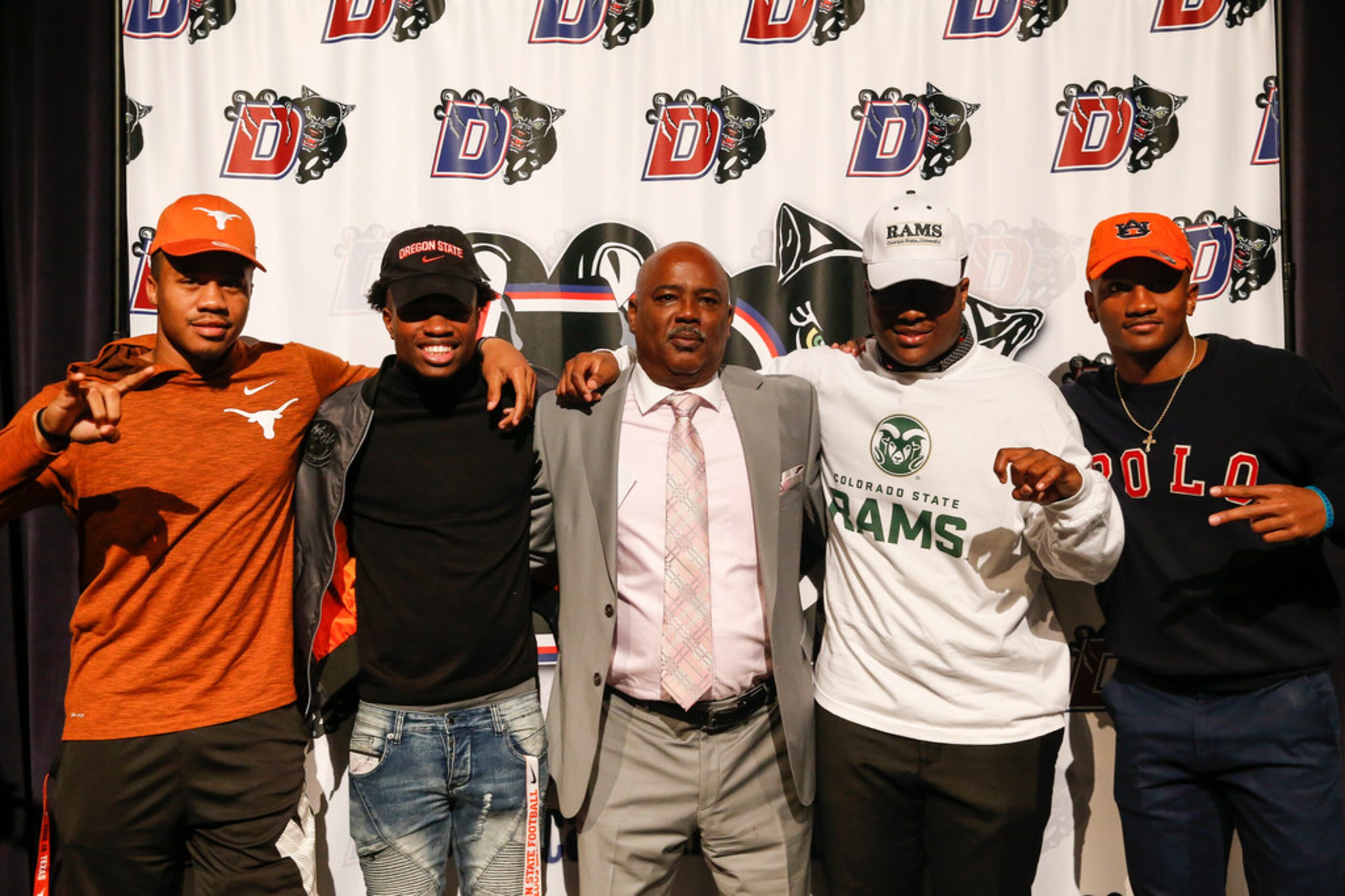 Football players Ja'Quinden Jackson, left, Zeriah Beason, second from left, James Mitchell,...