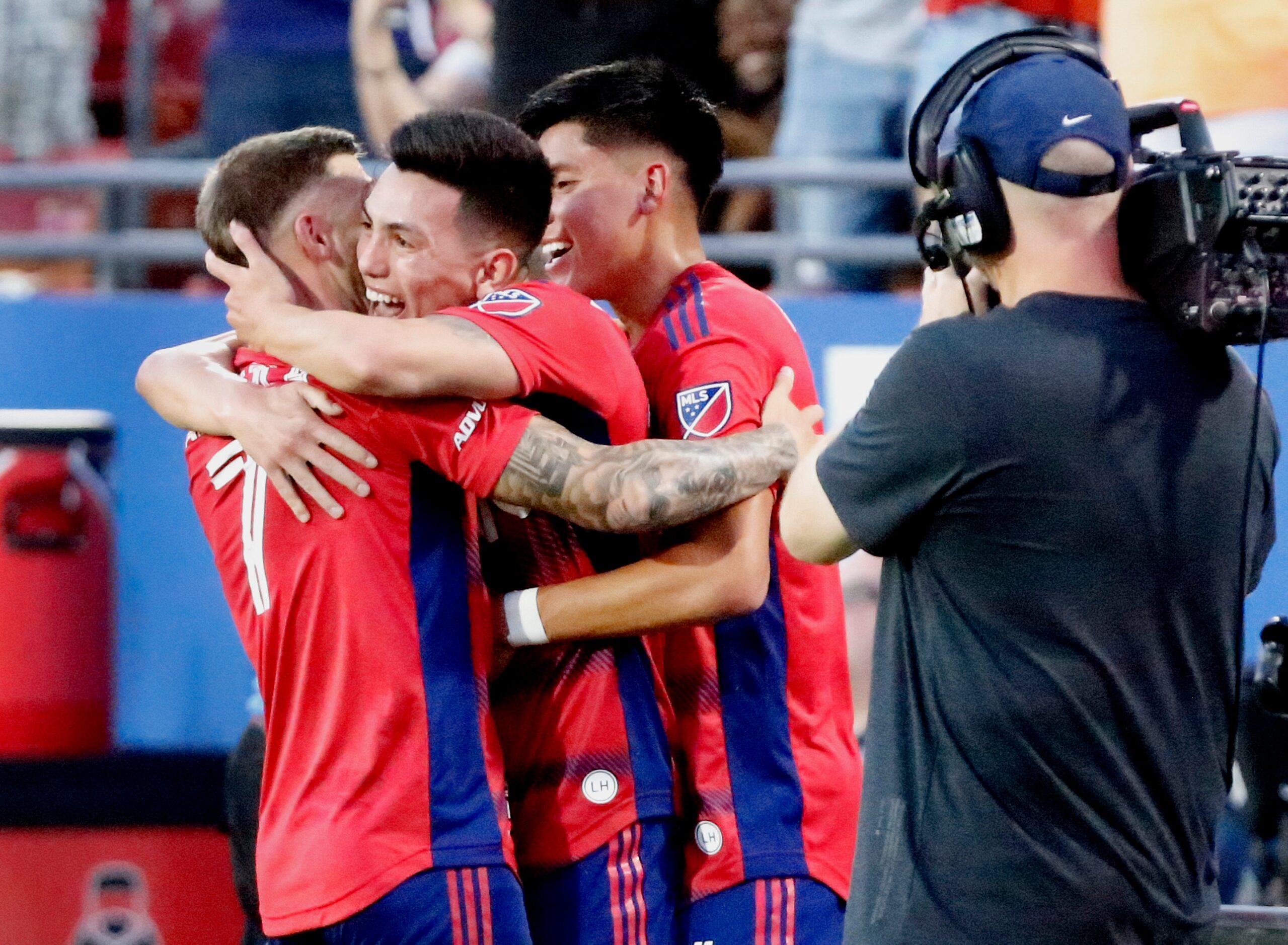 FC Dallas forward Paul Arriola (7) and FC Dallas defender Marco Farfan (4) embrace FC Dallas...