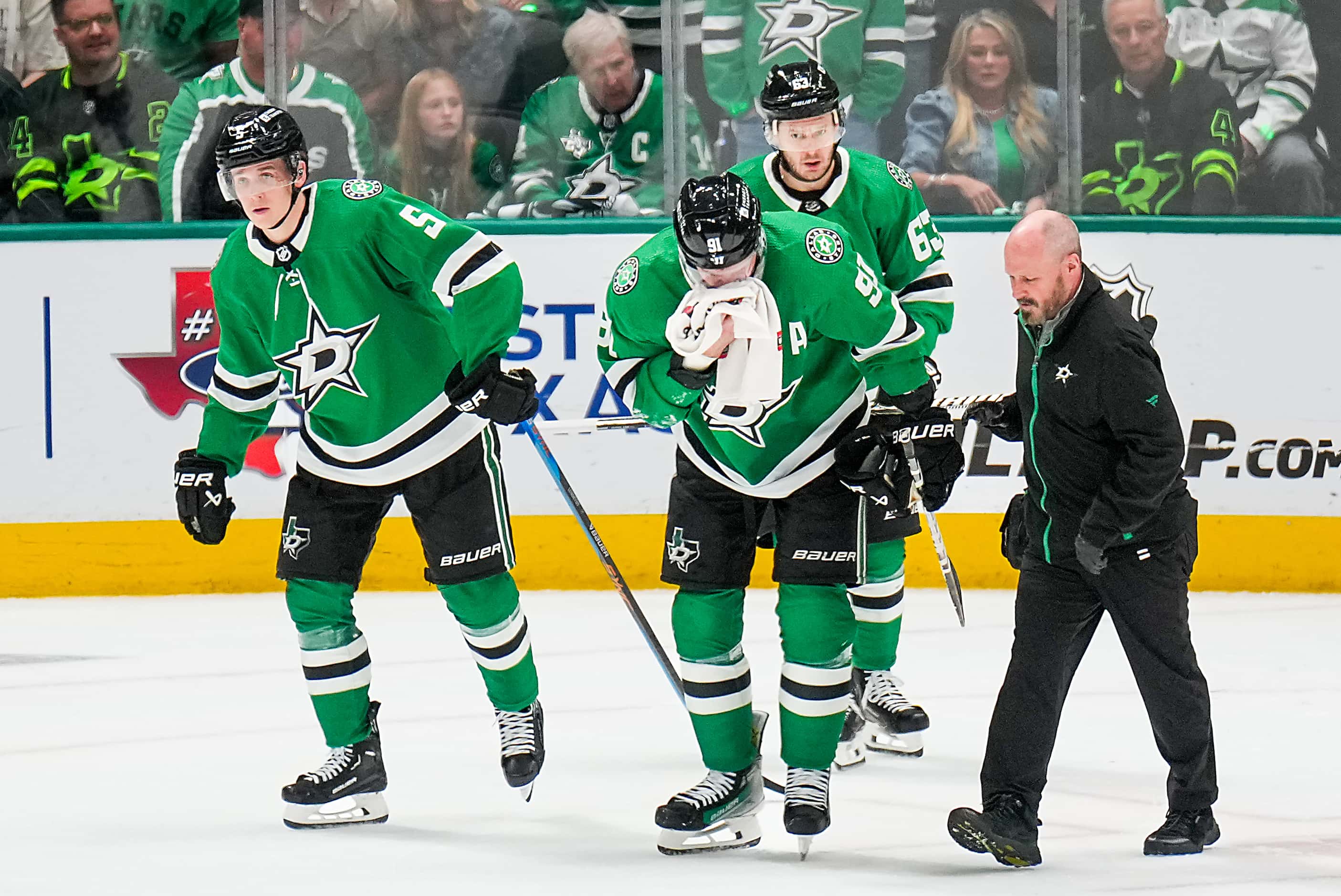 Dallas Stars center Tyler Seguin (91) leaves the ice after he was injured on a roughing...