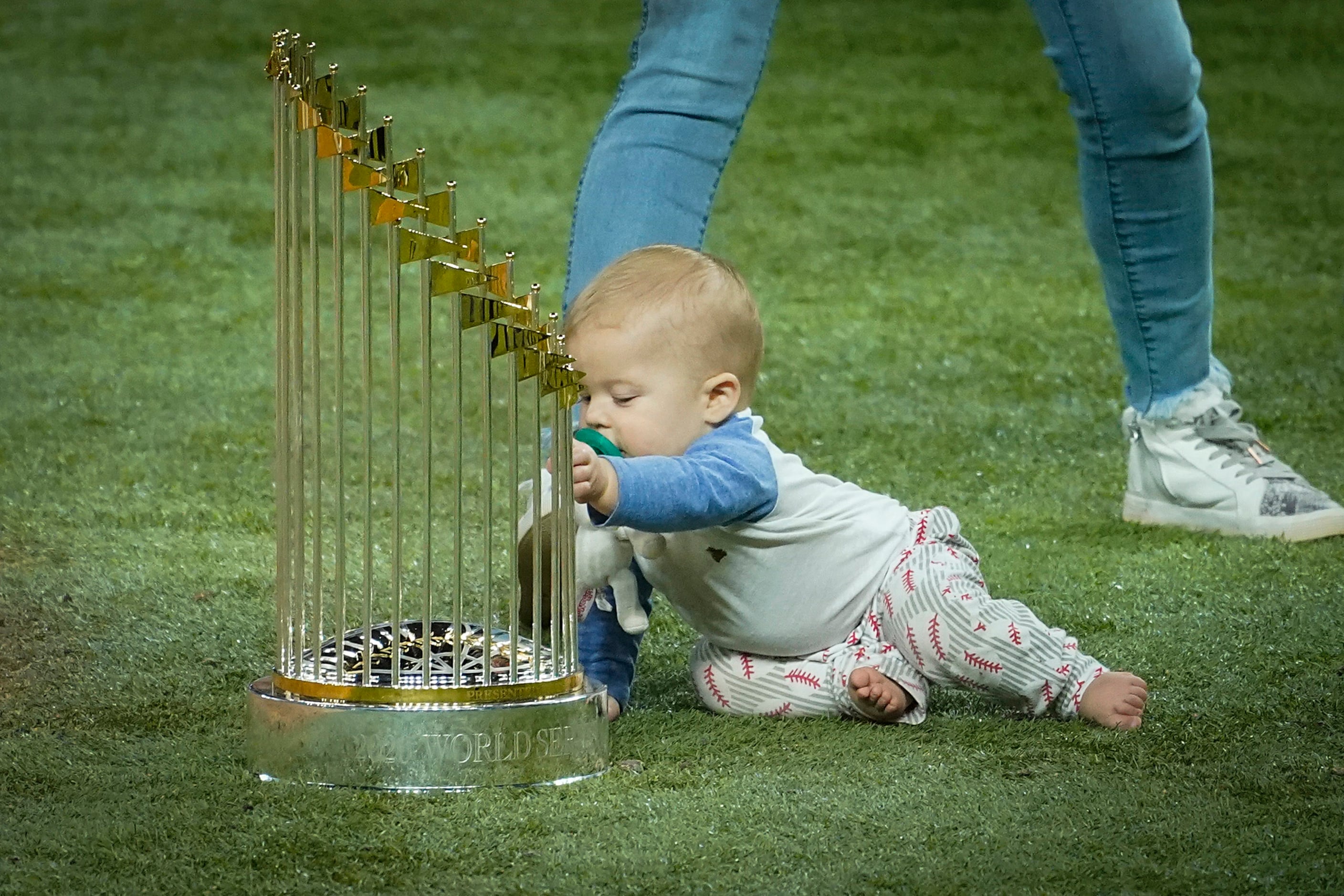 Los Angeles Dodgers starting pitcher Clayton Kershaw’s baby Cooper Ellis Kershaw plays with...