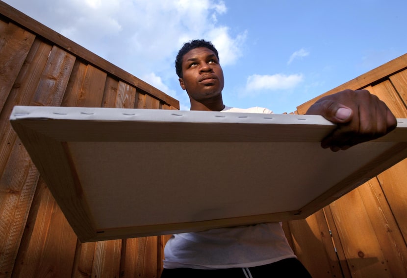 Frisco track sprinter Xxavier Carter with a painting canvas outside his home in Frisco. An...