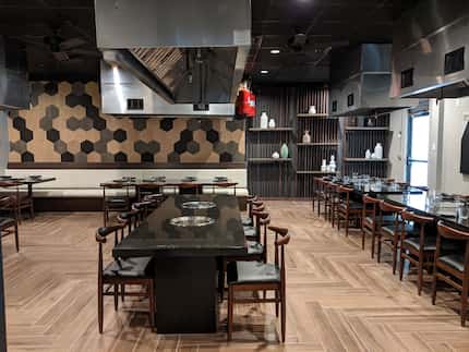 A private dining hall inside Koryo seats more than 40 guests at tables with built-in...