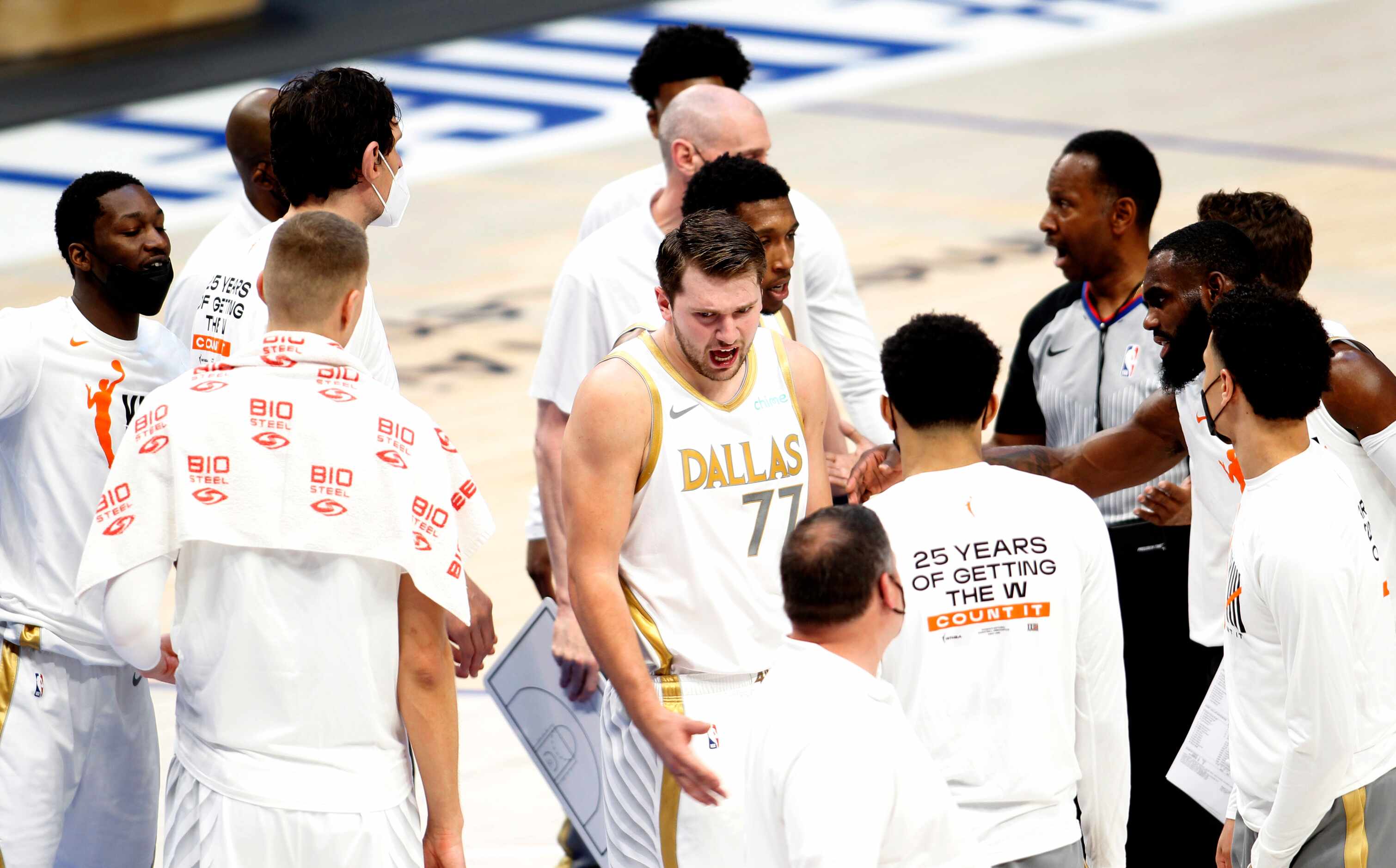 Dallas Mavericks point guard Luka Doncic (77) is angered by a call and turns away from a...