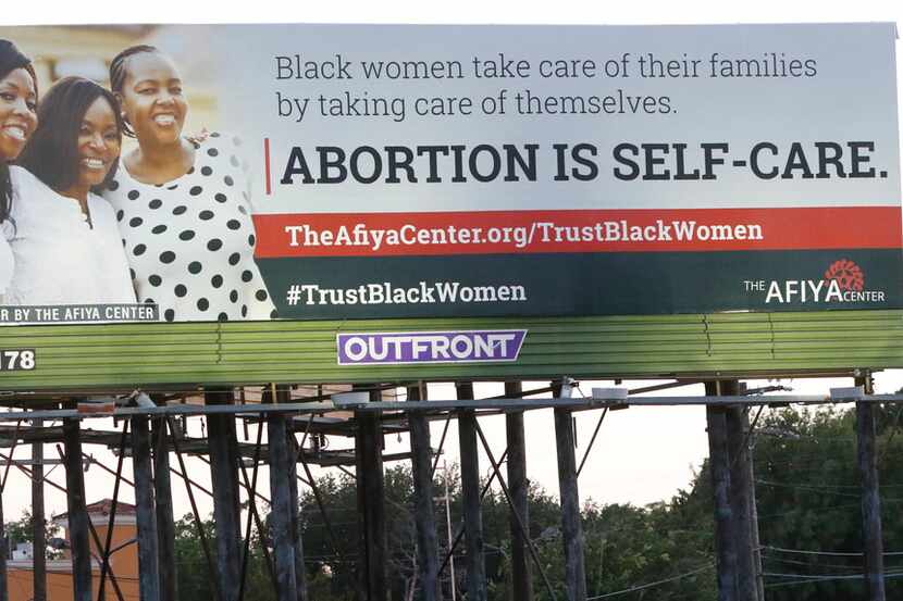 
A billboard put up by the Dallas-based Afiya Center proclaims "abortion is self-care" and...