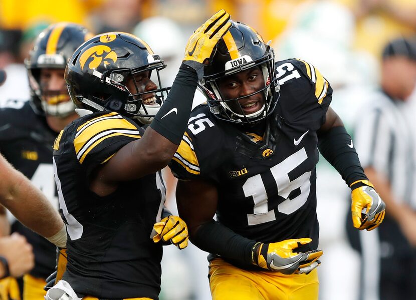 FILE - In this Sept. 16, 2017, file photo, Iowa's Josh Jackson (15) celebrates with teammate...