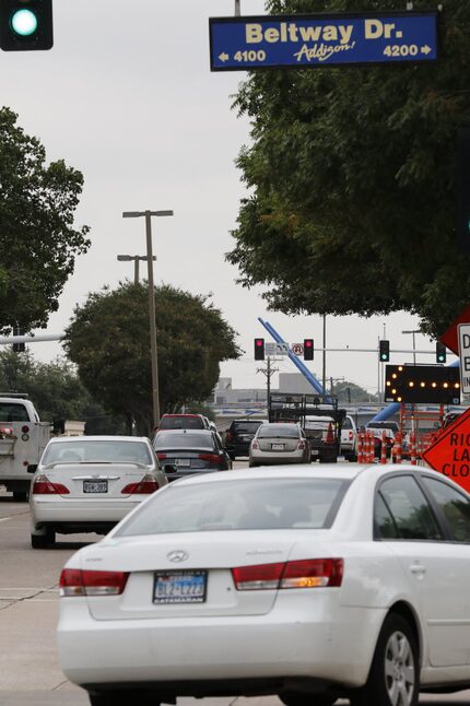 Vehicles travel on Midway Road at Belt Line Road in Addison.