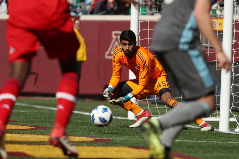 Chicago Fire goalkeeper Richard Sanchez (45) makes a save off a shot by Minnesota United...