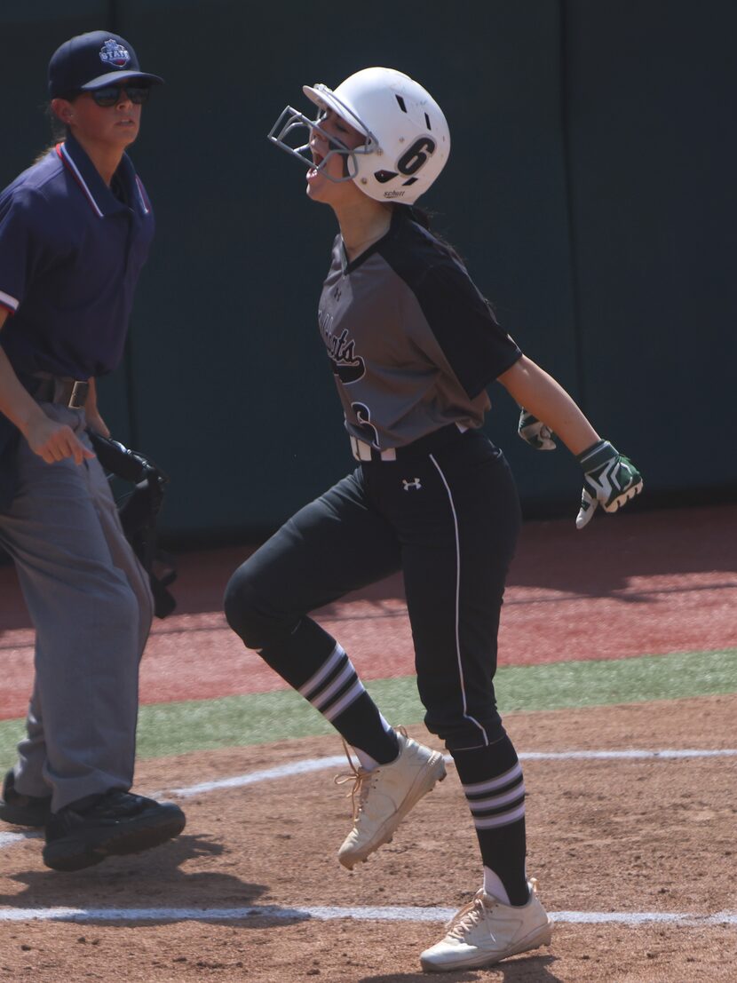 Denton Guyer's Kaylynn Jones (6) lets out a yell after scoring in the top of the first...