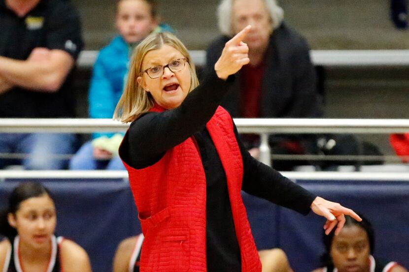 Irving MacArthur coach Suzie Oelschlegel gives instructions to her team near the end of a...