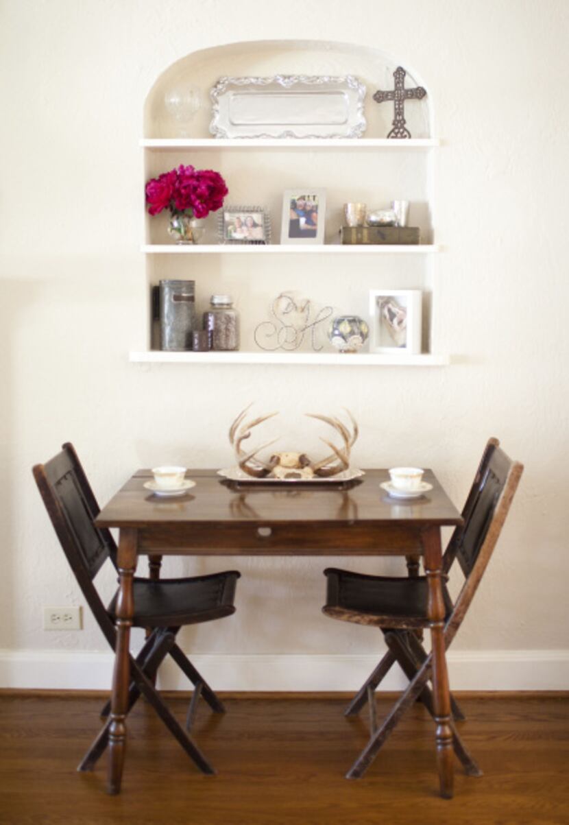 To keep her home from "getting too girly," Sarah Harmeyer added an antique table with...
