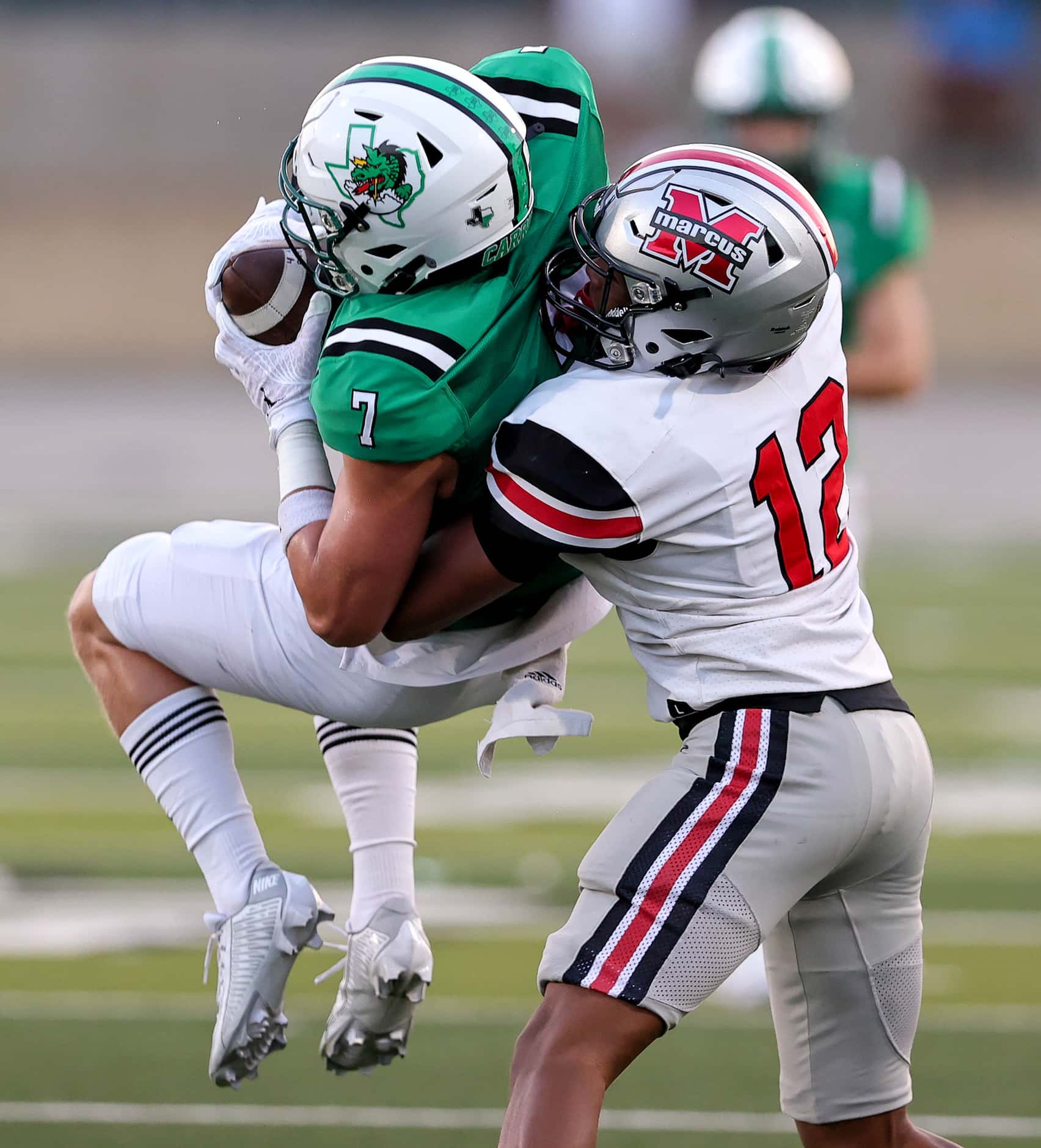 Southlake Carroll wide receiver Jacob Jordan (7) comes up with a reception in front of...