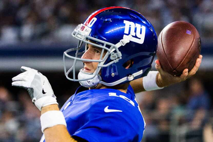 New York Giants quarterback Eli Manning (10) warms up before the Dallas Cowboys home opener...
