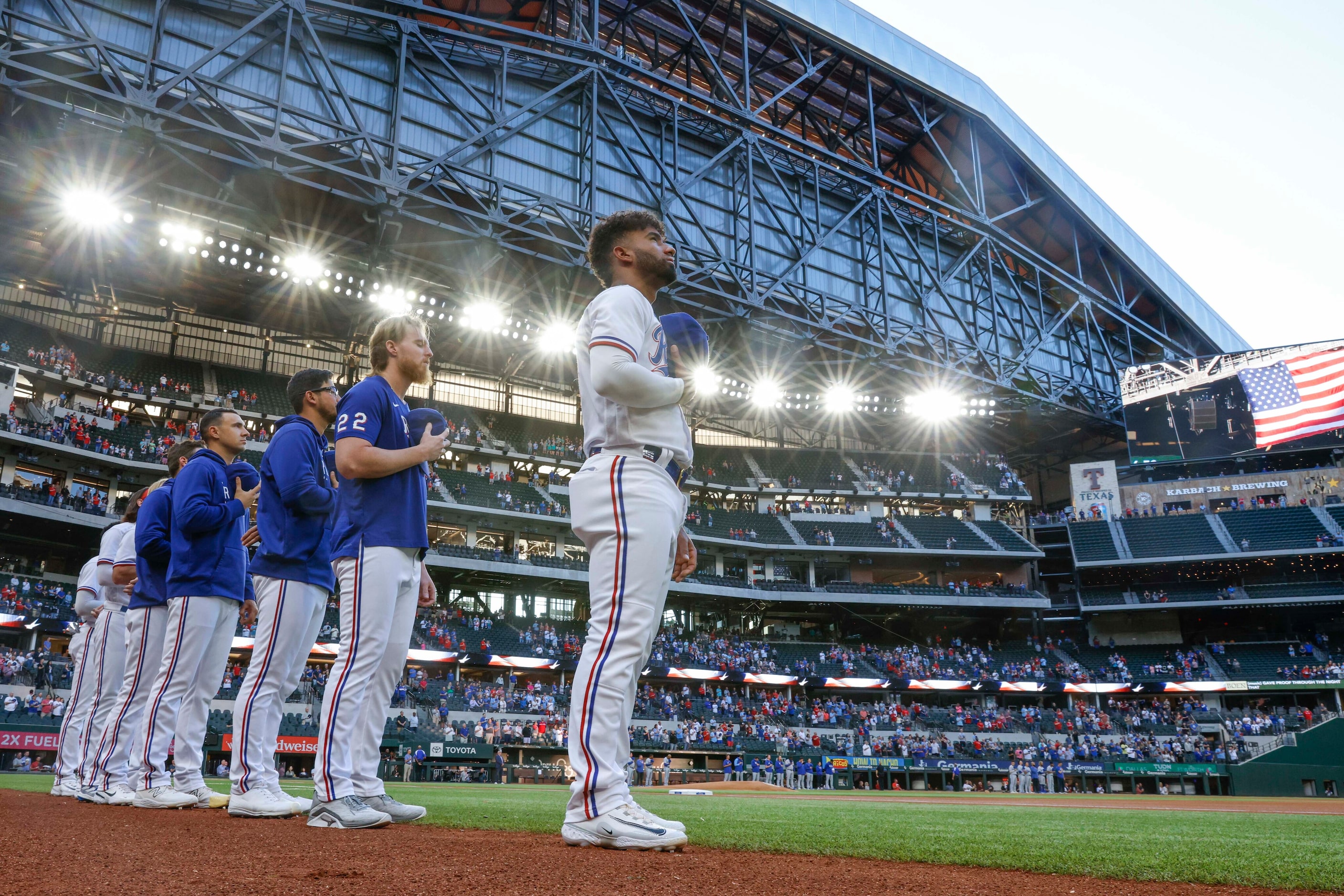 Texas Rangers players including pitcher Jon Gray (center left) and third baseman Ezequiel...