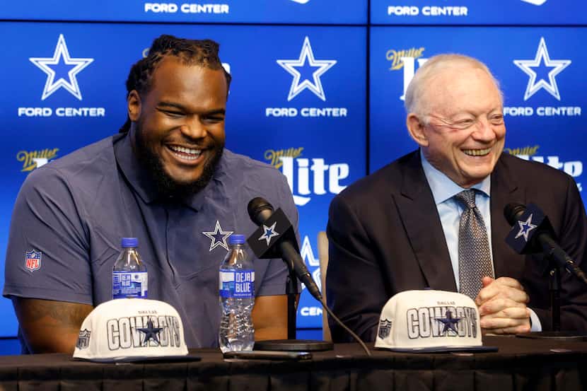 Dallas Cowboys rookie defensive tackle Mazi Smith (left) laughs with owner Jerry Jones...