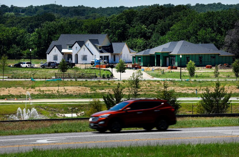 New homes are going up in former farm and and ranch land along U.S. Highway 377, which runs...