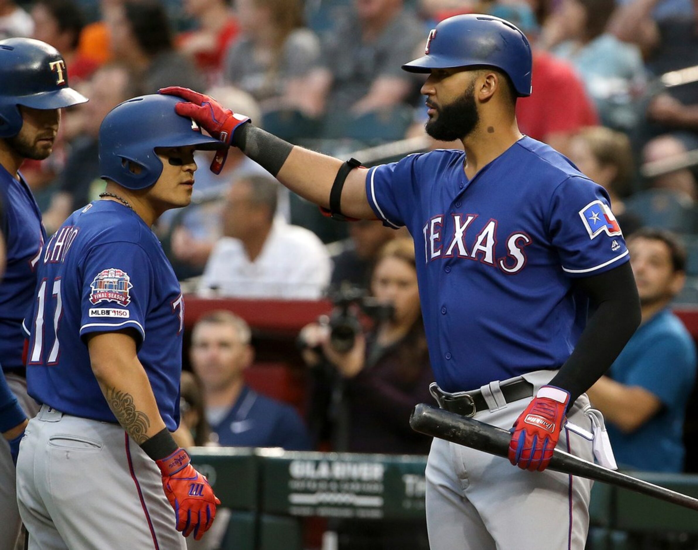 Texas Rangers' Shin-Soo Choo (17), of South Korea, celebrates after scoring against the...