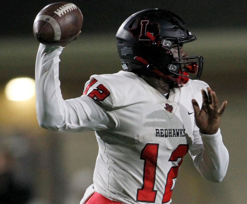 Former Frisco Liberty quarterback Keldric Luster (12) launches a pass during first quarter...