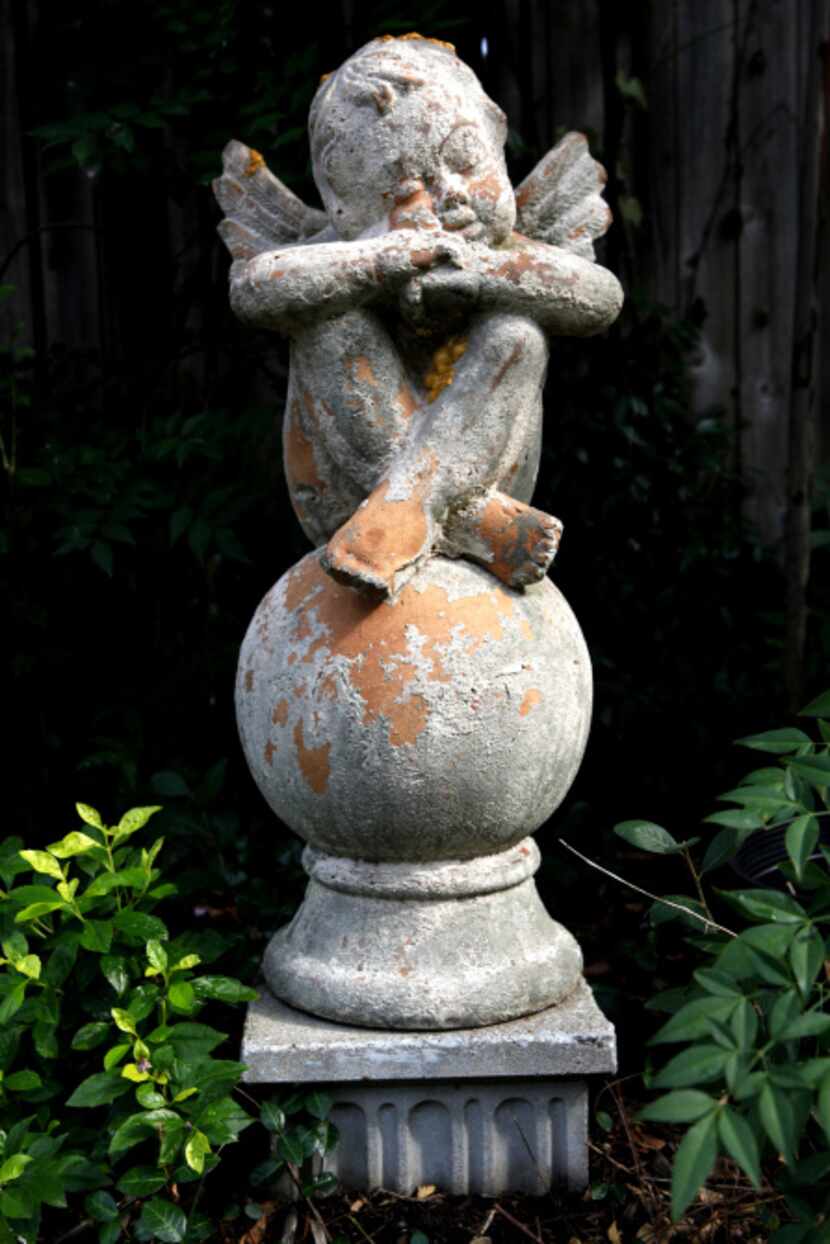 A statue in Christy Hodges' traditional English garden pictured on September 13, 2013 at her...