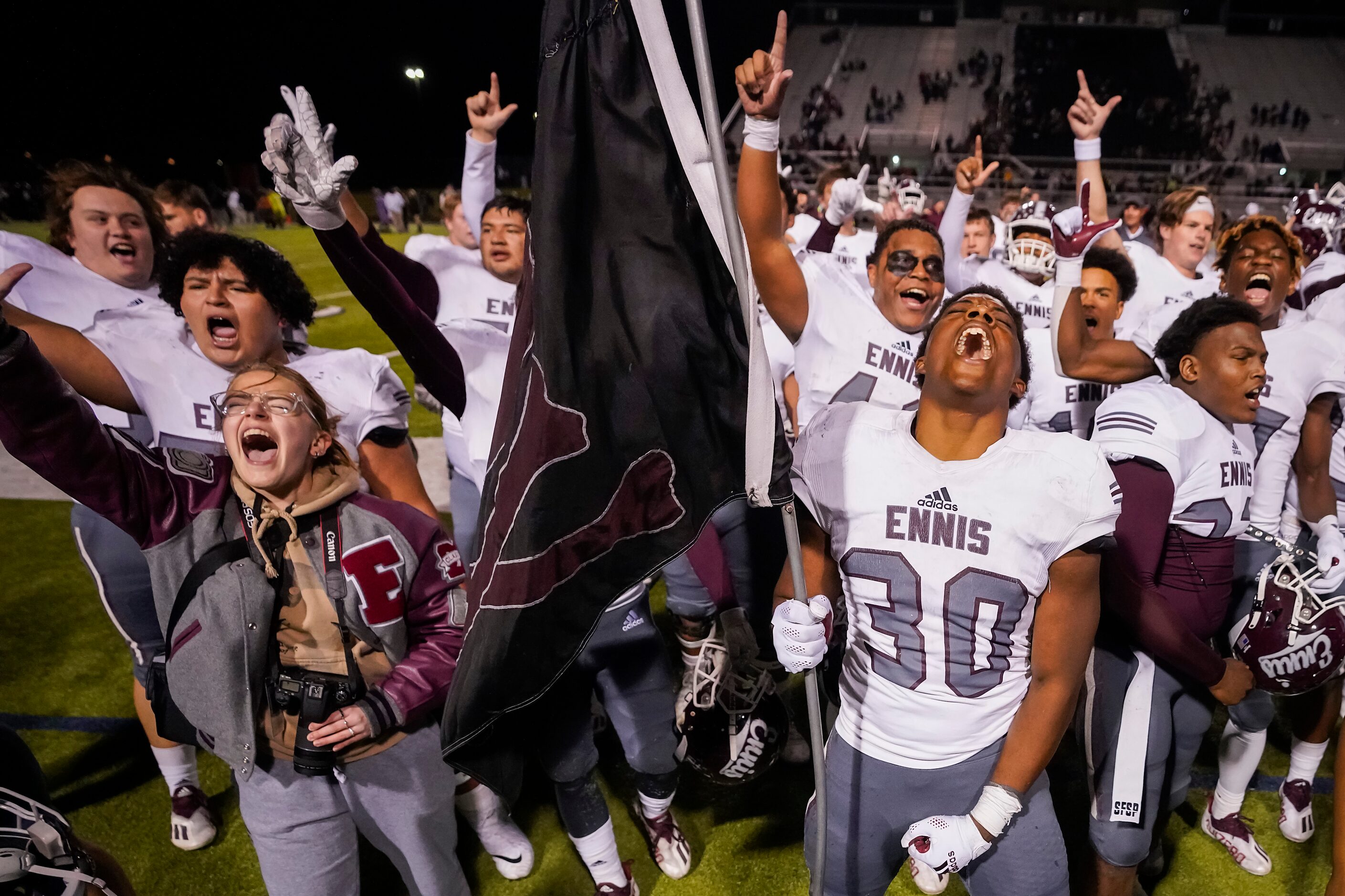 Ennis defensive lineman Jamioreous Myers (30) celebrates with teammates after a 48-20...