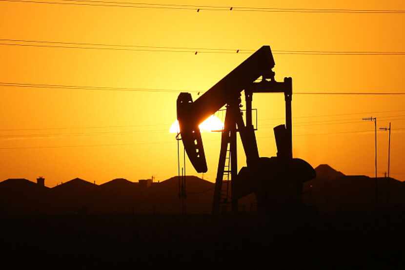 A file photo shows a pumpjack on the outskirts of a Permian Basin oil field near the oil...