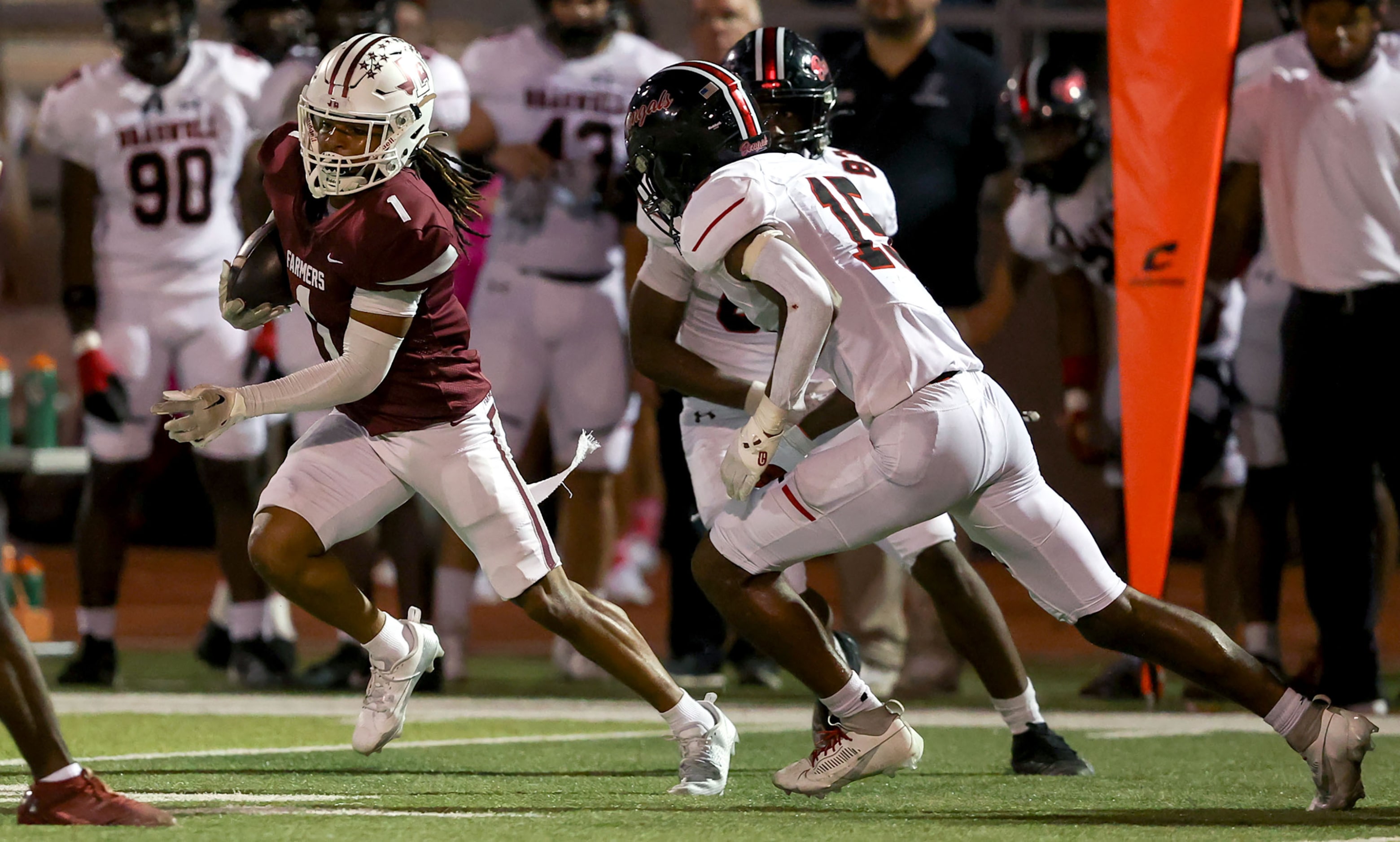 Lewisville kick returner D'Angelo King (1) tries to elude Denton Braswell's Kadin Wright...