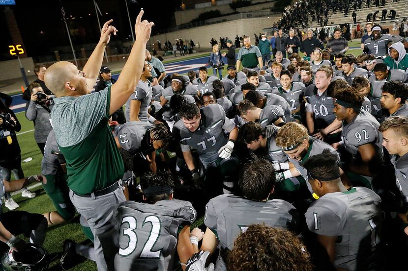 Prosper head coach Brandon Schmidt addresses his team after they closed their victory with a...