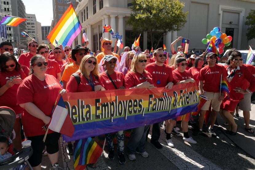 Delta Airlines employees, family and friends pose for a group photo at the 2014 Pride Parade...