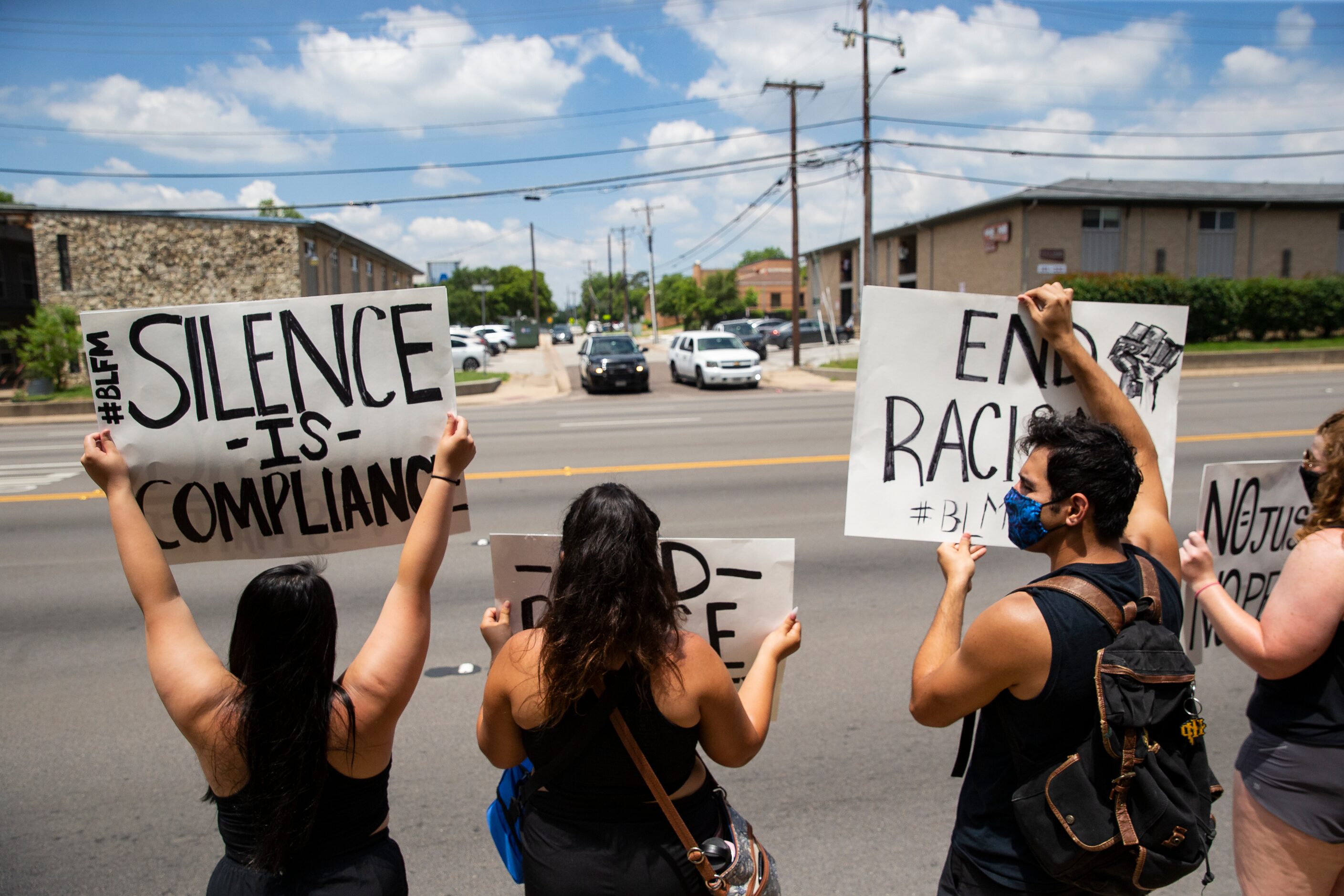 Protestors against police brutality line S Cooper St as they participate in the UTA School...