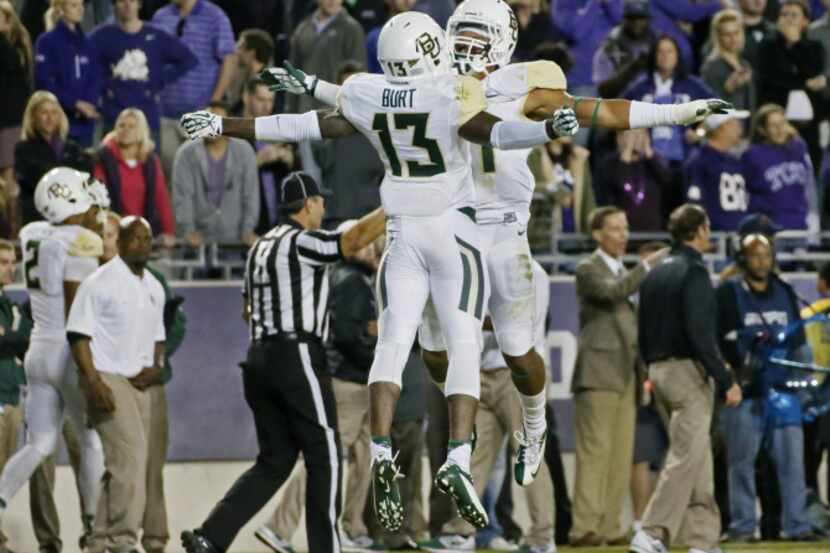 Baylor safety Terrell Burt (13) celebrates with teammate Patrick Levels (21) after...