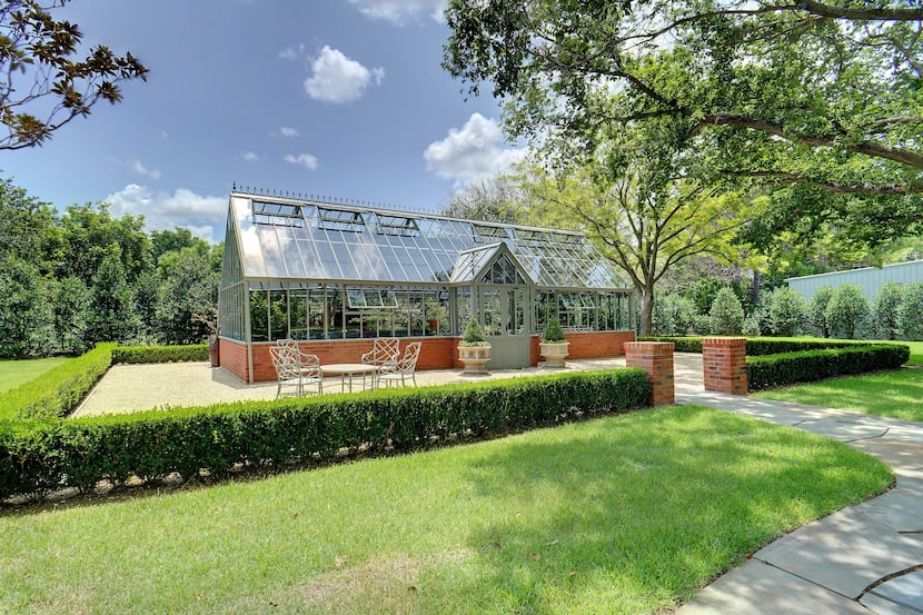 The classically styled greenhouse on the property at 6401 Westcoat Drive in Colleyville has...