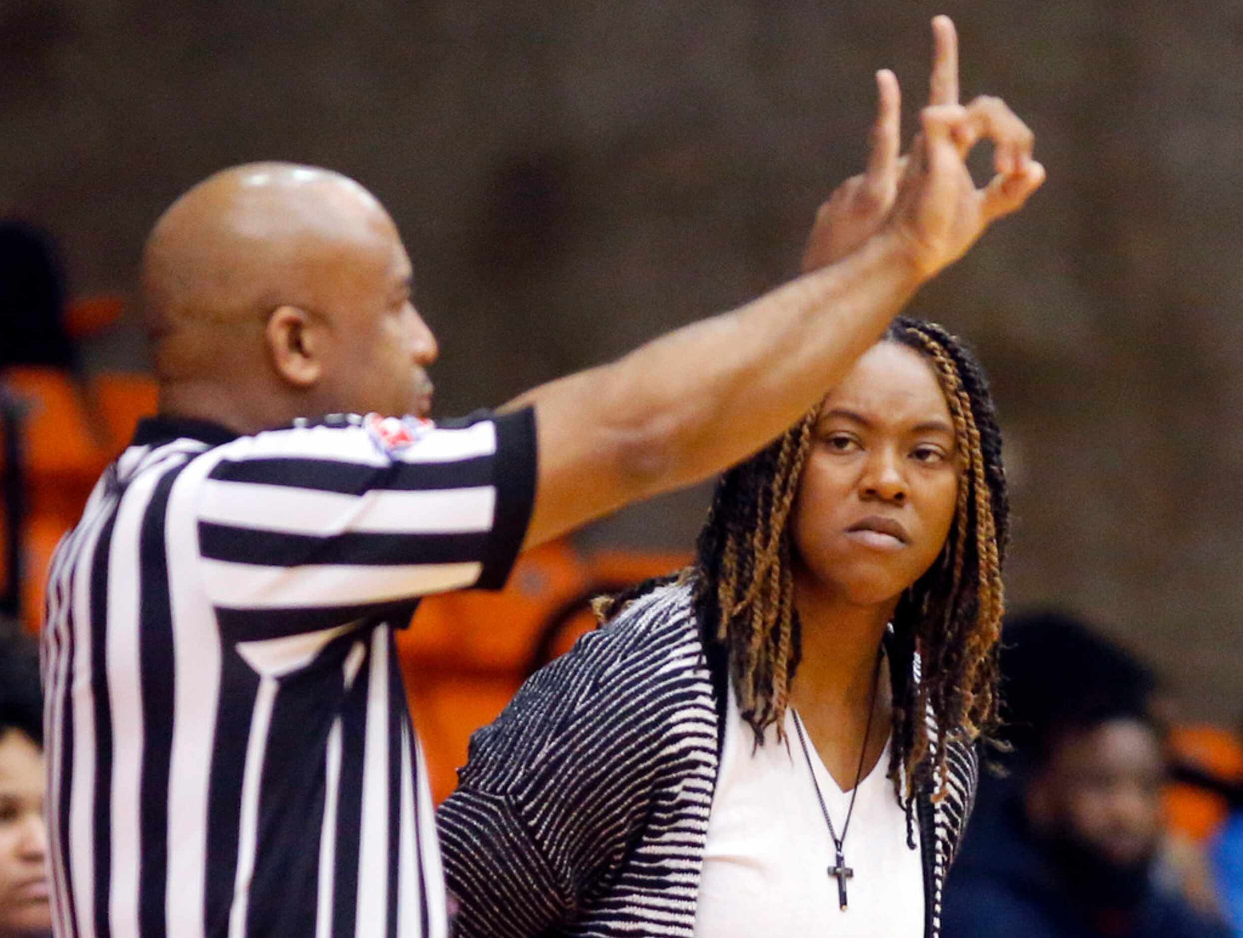 Duncanville's LaJeanna Howard stares down an official who called a foul on her player during...