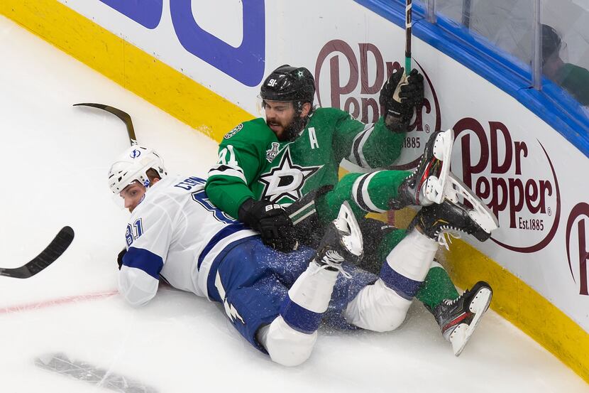 Tyler Seguin (91) of the Dallas Stars collides with Erik Cernak (81) of the Tampa Bay...