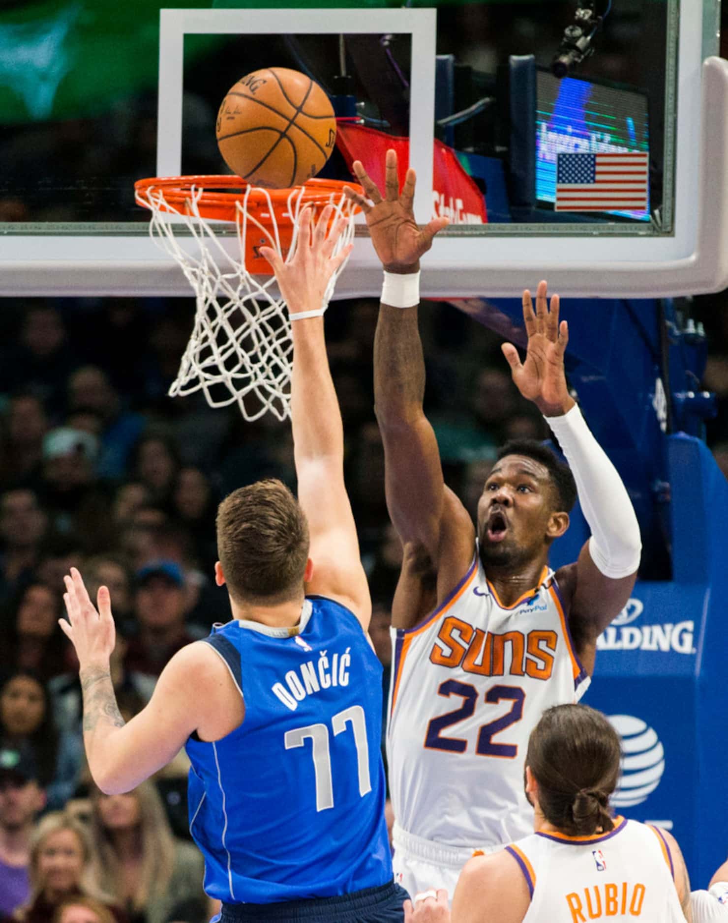 Dallas Mavericks guard Luka Doncic (77) goes up for a shot against Phoenix Suns center...