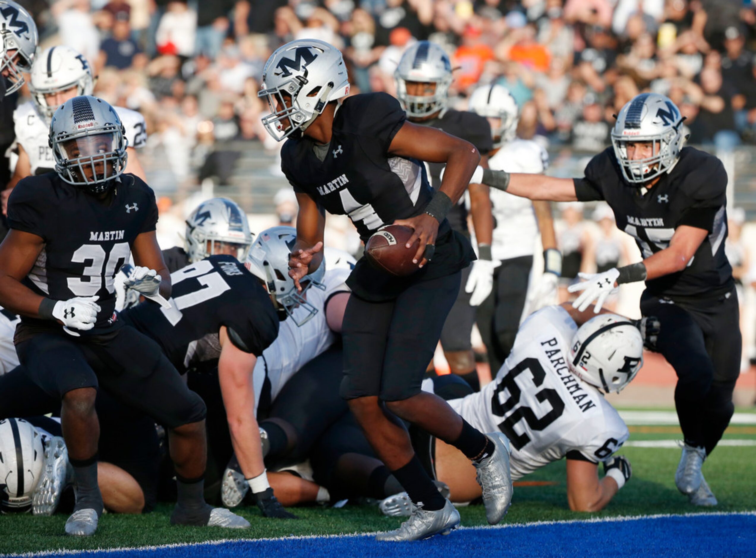 Arlington Martin quarterback Juma Otoviano  (8) scores on a keeper as Odessa Permian...