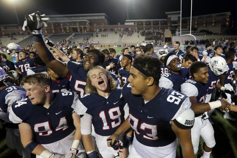 Allen High School football players celebrate a win over Coppell High School at Eagle Stadium...