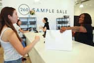 Customers check out at the counter of the 260 Sample Sale location in Dallas.