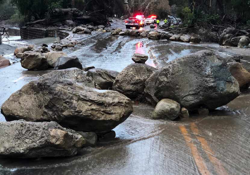 In a Santa Barbara County Fire Department photo, rocks cover a road after a mudslide in...