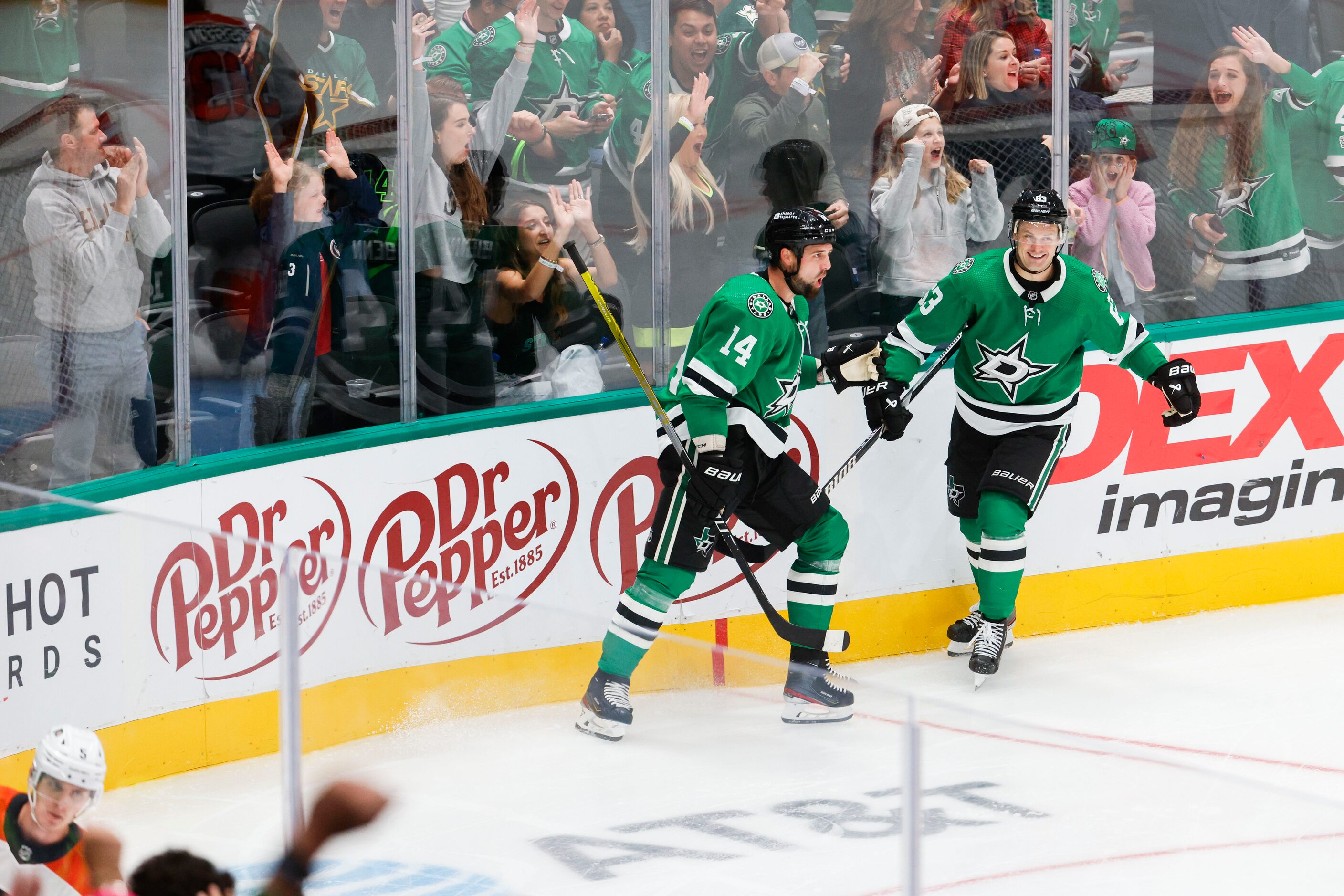 Dallas Stars left wing Jamie Benn (left) celebrates a goal with right wing Evgenii Dadonov...