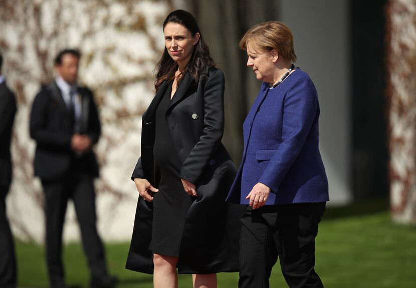 German Chancellor Angela Merkel (right) and pregnant New Zealand Prime Minister Jacinda...