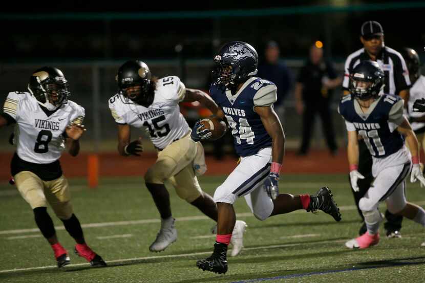 Carrollton Ranchview's Joshua Walker (24) scores a touchdown against Pinkston during the...