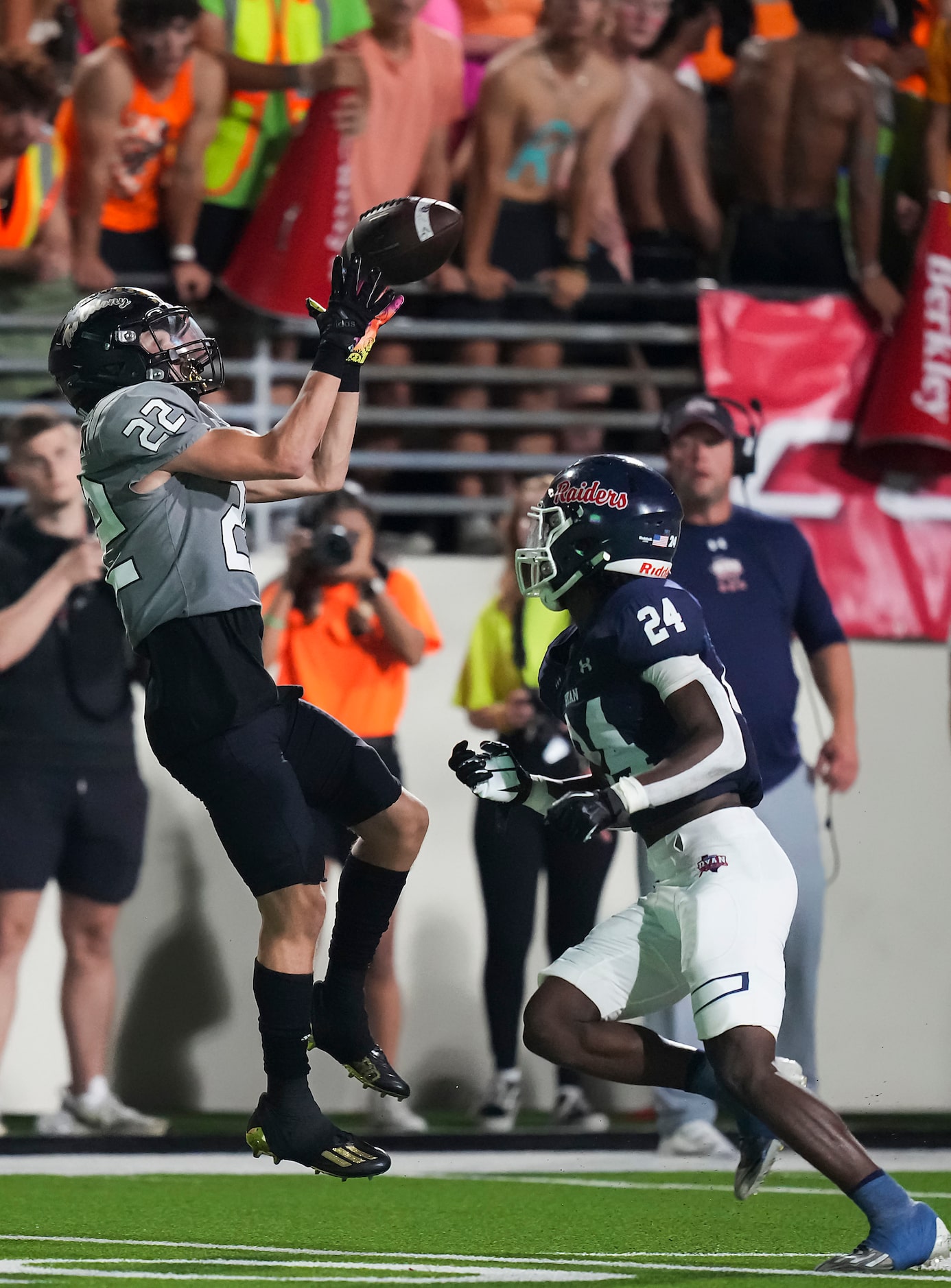 The Colony wide receiver Xavier Green (22) catches a pass as Denton Ryan defensive back...