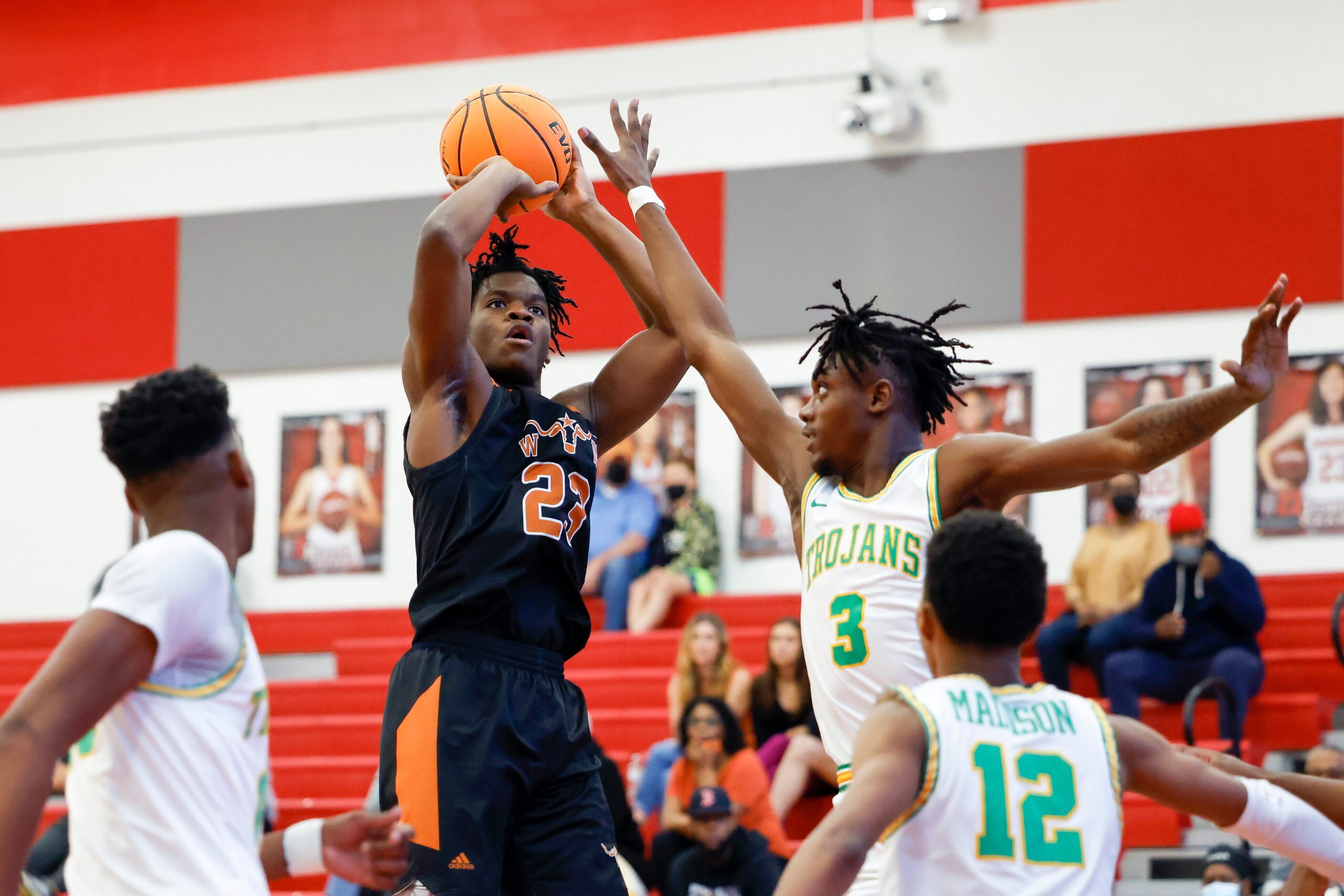 W.T. White forward PJ Washington (23) attempts a shot over Madison forward Leonard Miles IV...