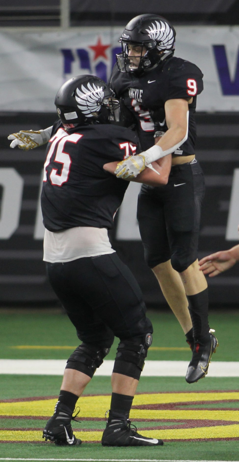 Argyle running back Tito Bice (9) is lifted by offensive lineman Jack Tucker (75) during an...