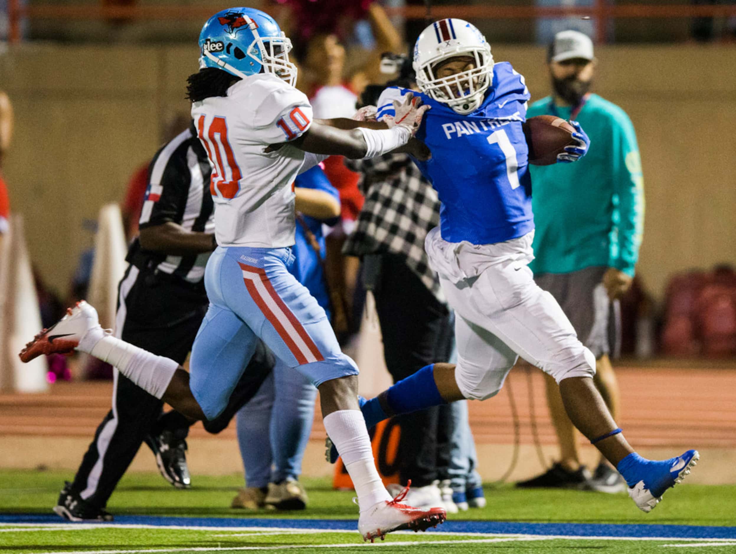 Duncanville running back Trysten Smith (1) is pushed out of bounds by Skyline defensive back...