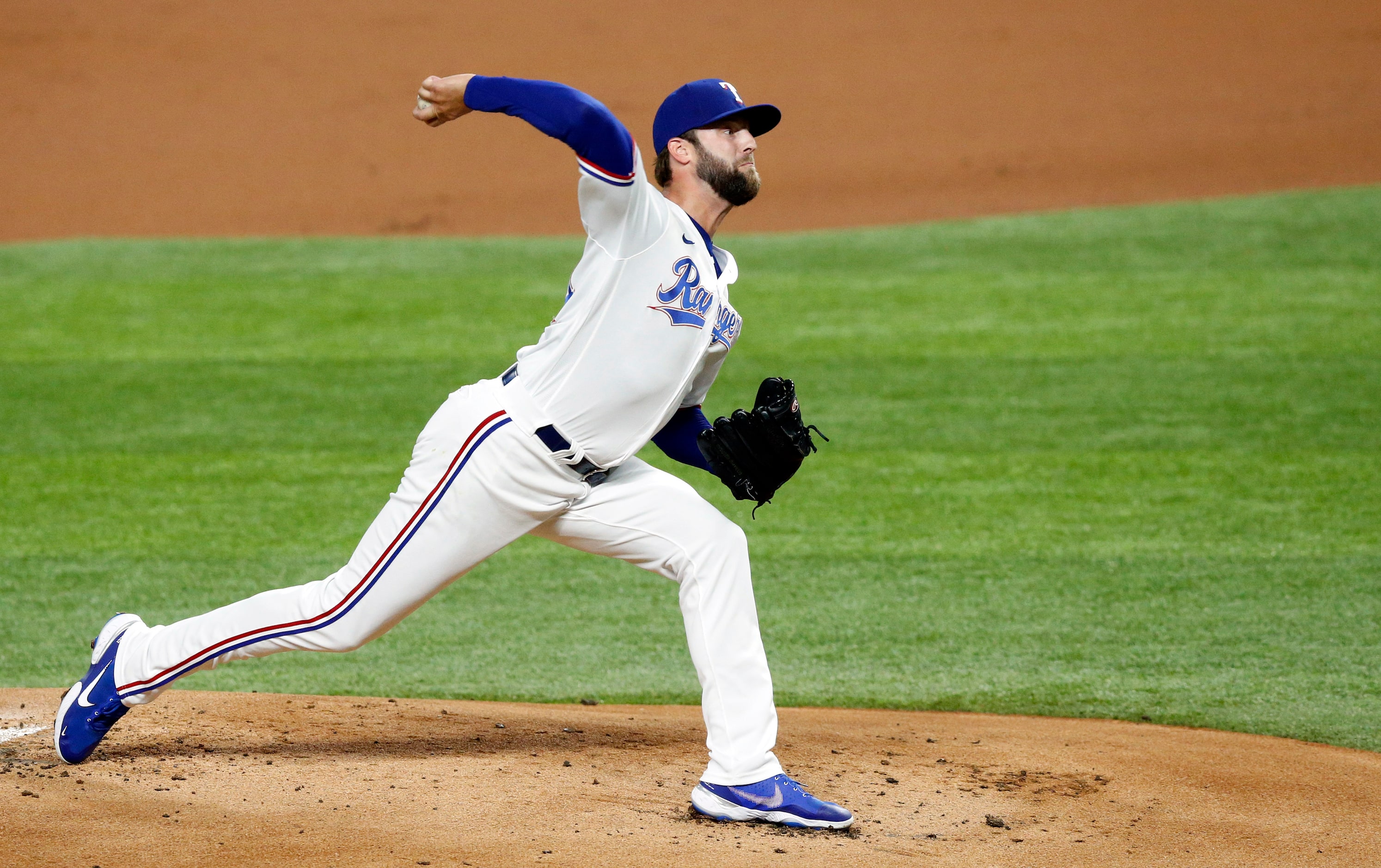 Texas Rangers starting pitcher Jordan Lyles (24) throws during the first inning against the...