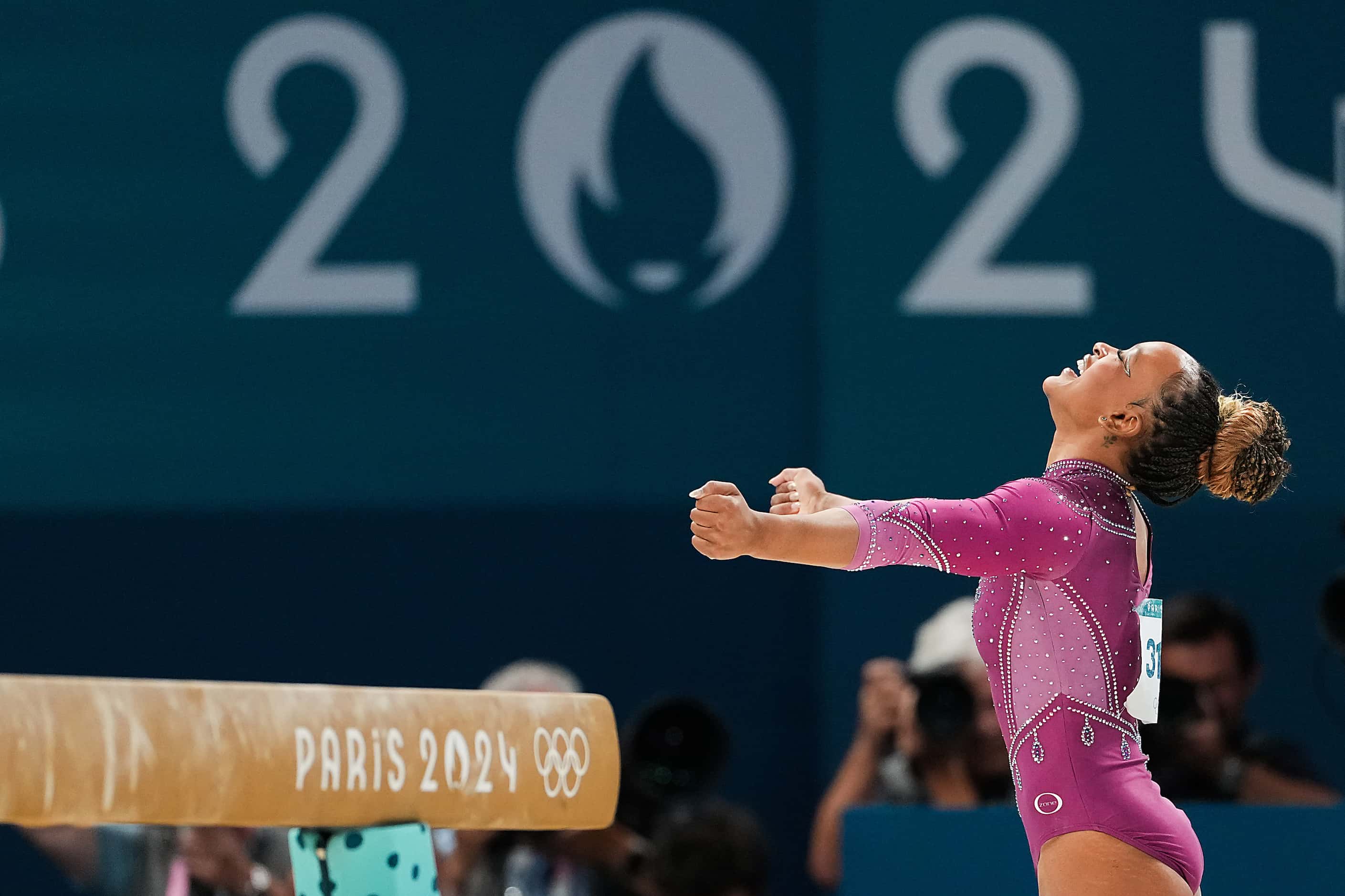 Rebeca Andrade of Brazil celebrates after competing on the balance beam during the women’s...