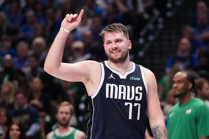 Dallas Mavericks guard Luka Doncic reacts after being called for a foul during the first...