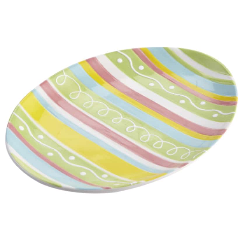Colorful egg-shaped plates for serving snacks or appetizers foretell the arrival of the...